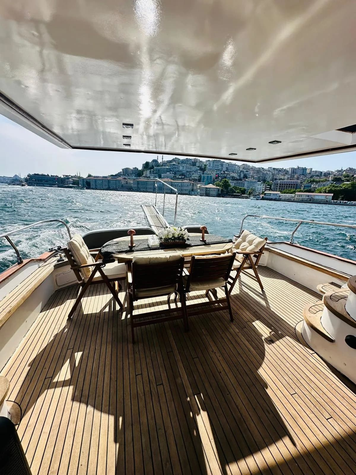 Private yacht cruising on open water with Istanbul coastline in the distance