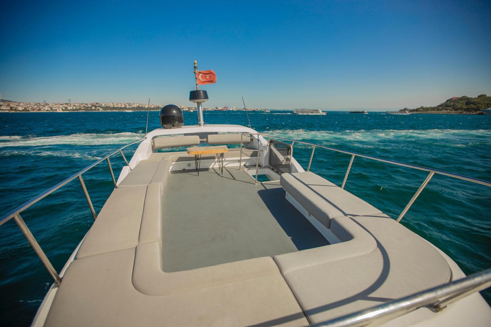 Private yacht boarding area on the Bosphorus with marina staff preparing a vessel for departure in Istanbul
