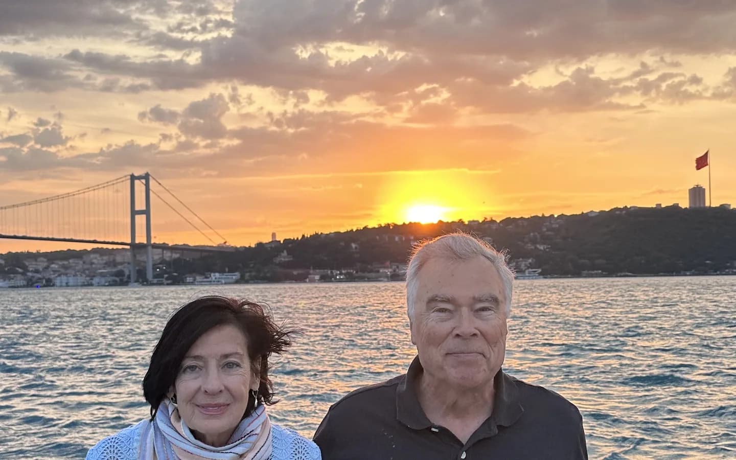 Bosphorus sunset cruise Istanbul 2026 — golden hour view of Ortakoy Mosque and Bosphorus Bridge from a licensed sunset cruise boat