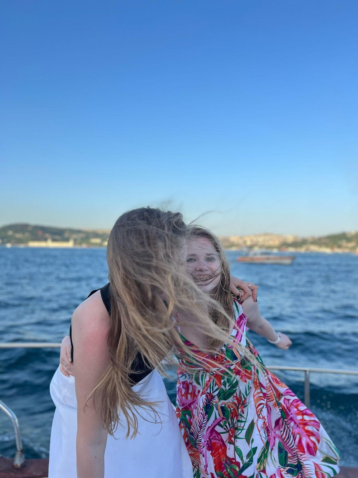 Lunch spread on a Bosphorus cruise boat deck with Istanbul skyline visible in the background