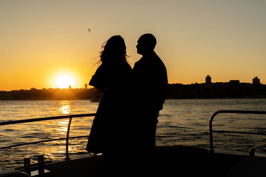 A couple in silhouette against the sunset