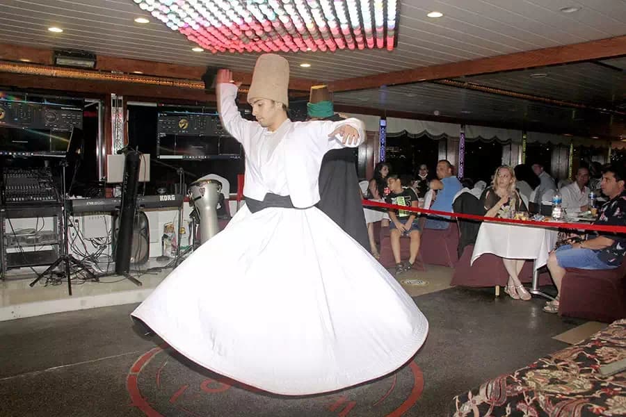 A whirling dervish performing at a dinner show