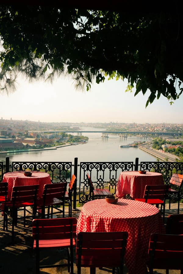 Café tables with red cloths overlooking the Golden Horn