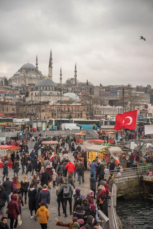 Crowds in Eminönü with a mosque behind