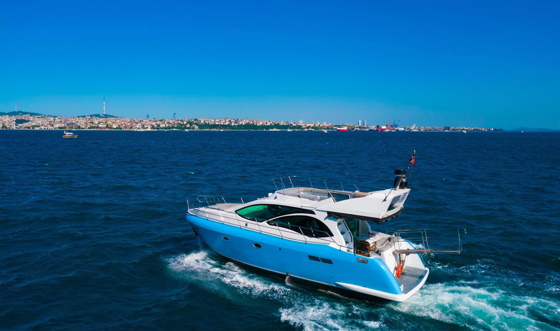 Private motor yacht crossing the Bosphorus — GoldenSunsetTour charter